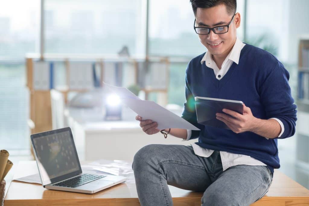 IT manager reviewing a Singapore payroll provider’s ISO 27001 certification for vendor evaluation.